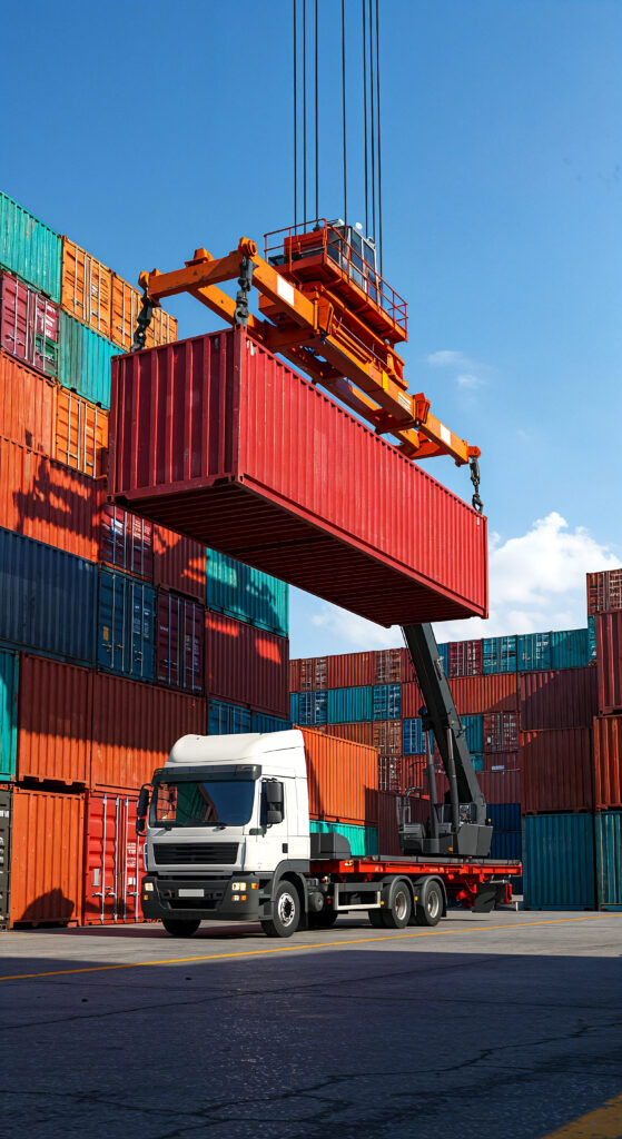 shipping container being loaded onto truck port
